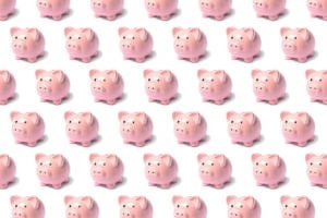 Pattern from a pink piggy bank on a white background.