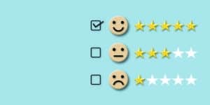 Customer evaluation concept. Check mark to select smile face with five stars on pastel blue background.