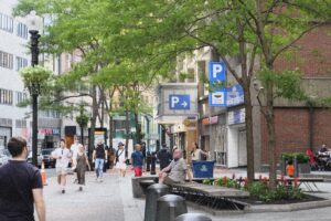 Pedestrians walk down Washington Street in downtown Boston in the summer of 2024.